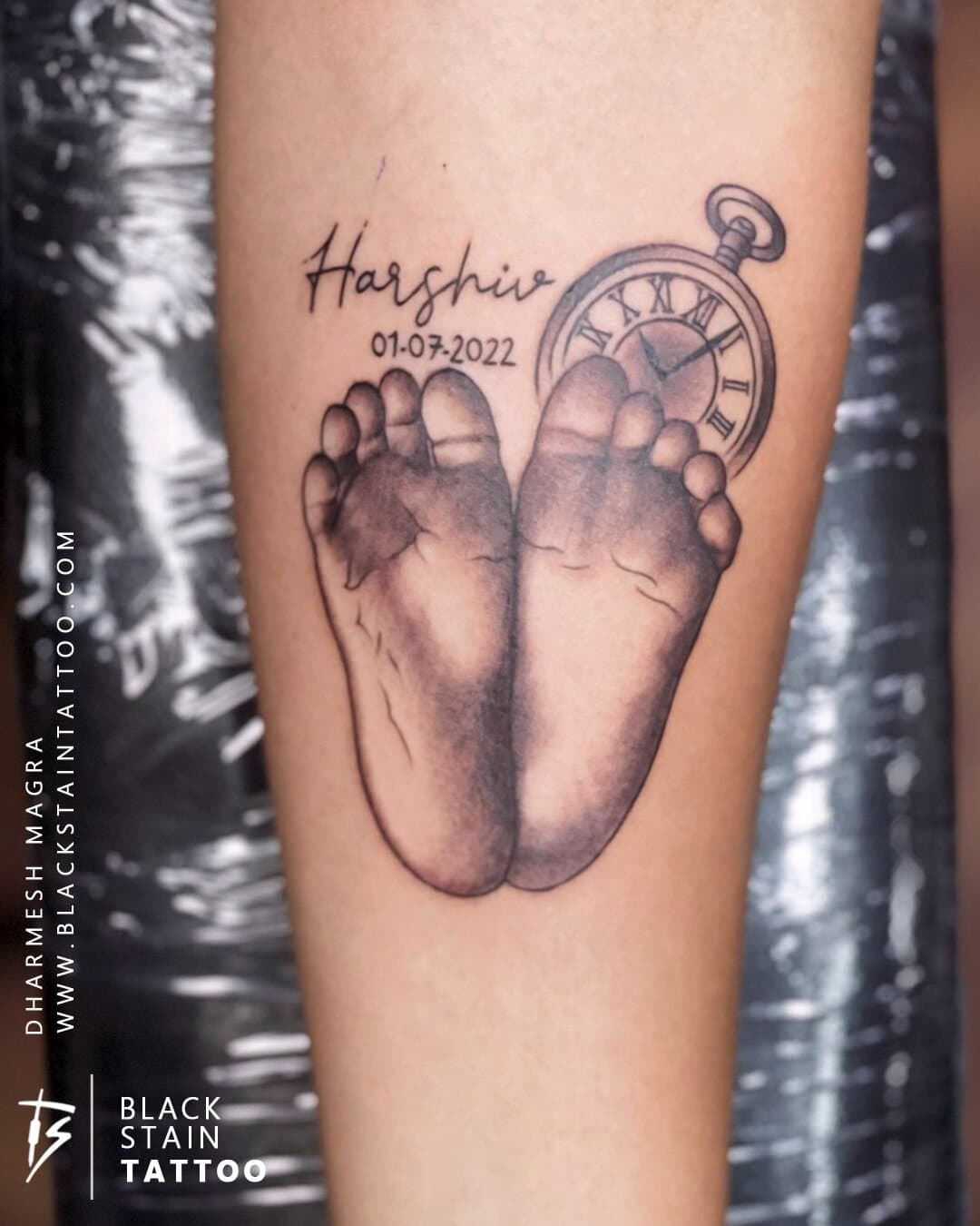 Baby footprint memorial tattoo with personalized text - meaningful tattoo artist Ahmedabad