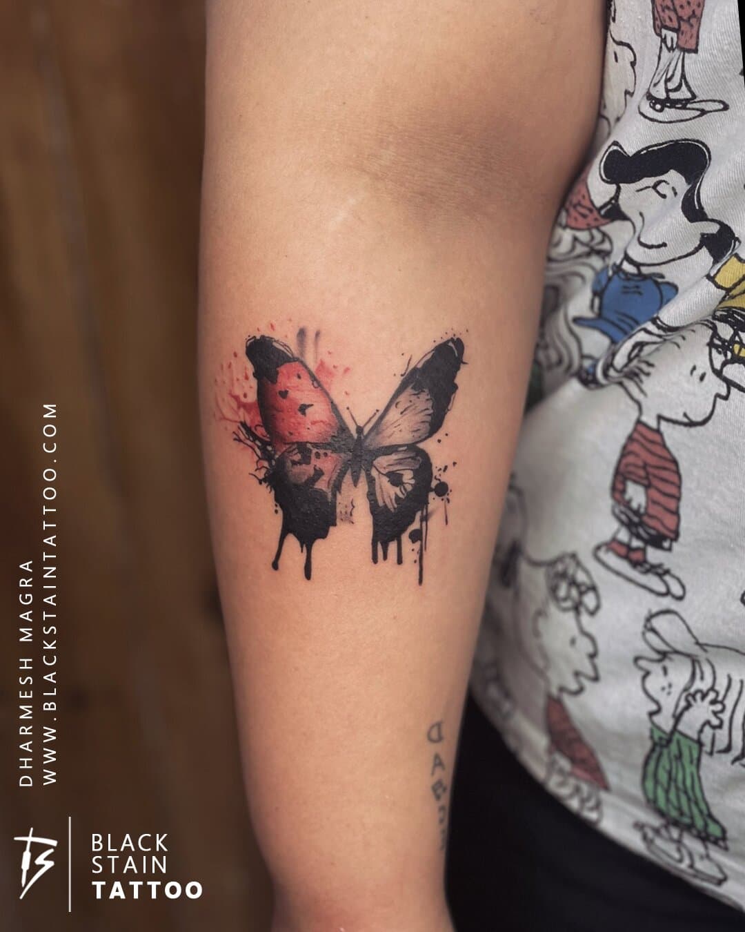 Watercolor butterfly tattoo with artistic splatter - colorful design Ahmedabad