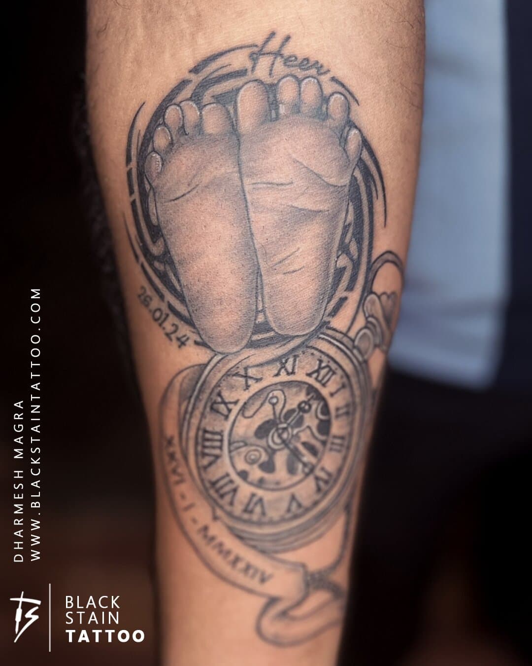 Baby footprint memorial tattoo with clock compass - meaningful tattoo artist Ahmedabad