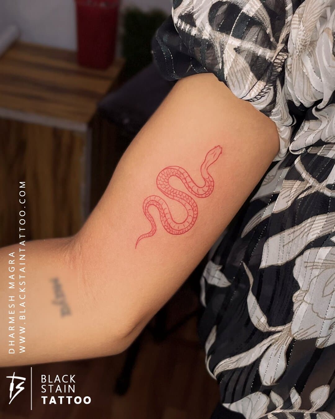 Colored pink snake tattoo with intricate scale work - tattoo design Ahmedabad