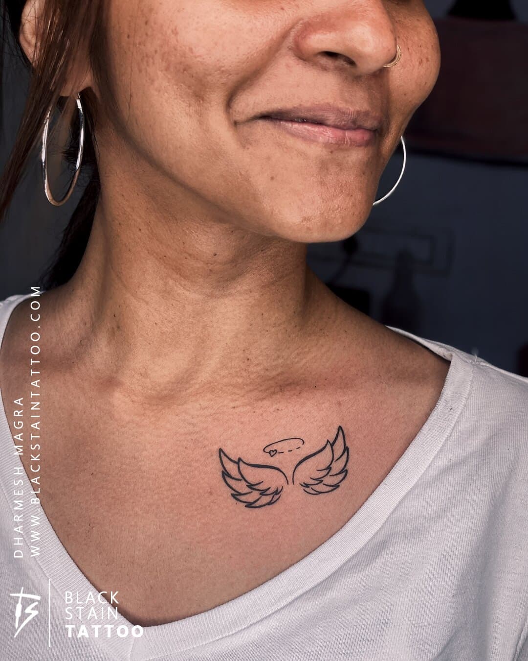 Small minimalist wings tattoo design - professional tattoo studio Ahmedabad